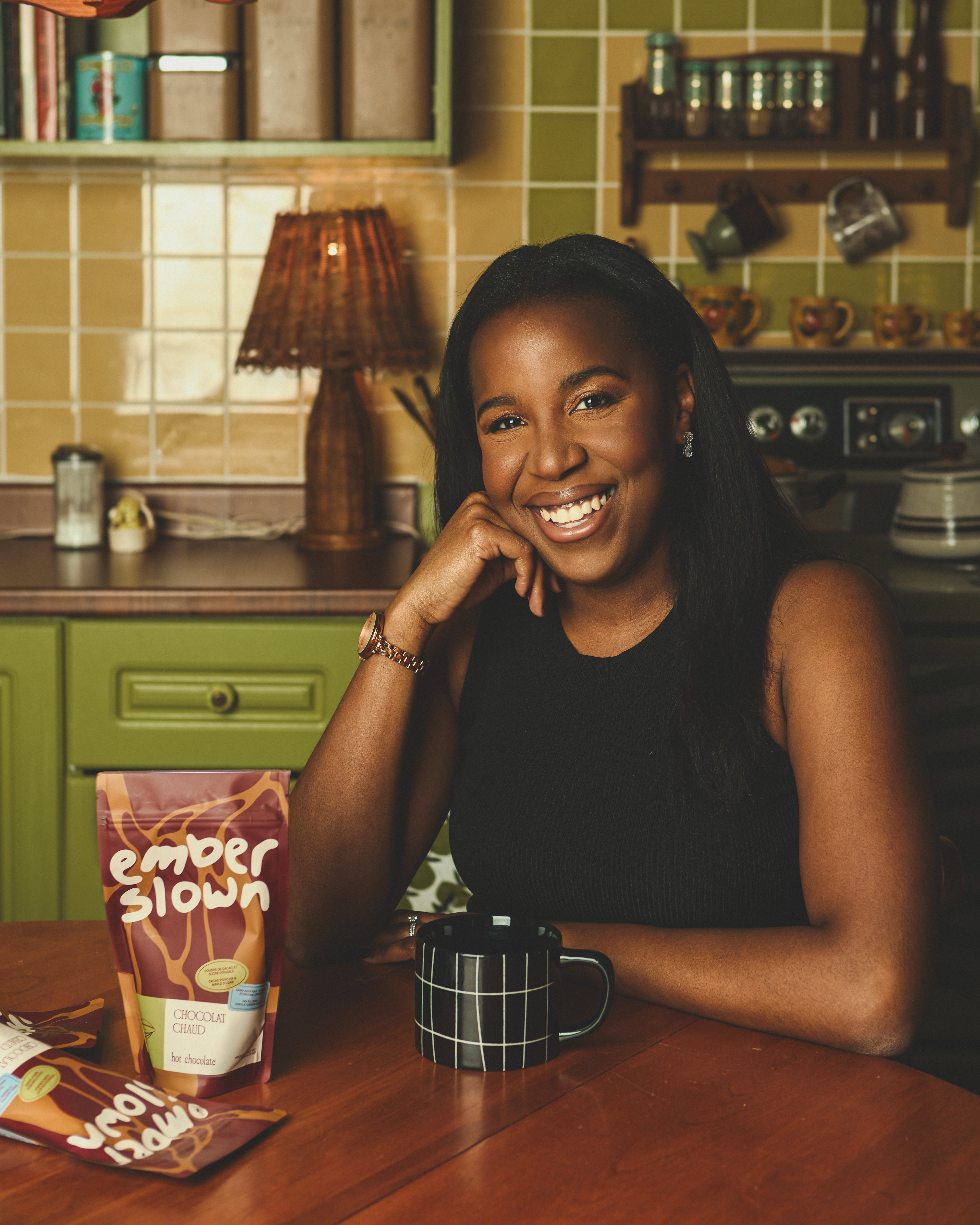 Anissa Tavares, founder of Ember Slown, with organic hot chocolate blend - Black-owned brand, Quebec Canada