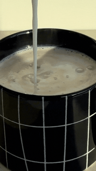 Ember Slown organic hot chocolate being prepared in a mug, mindful slow ritual, vegan drink Canada